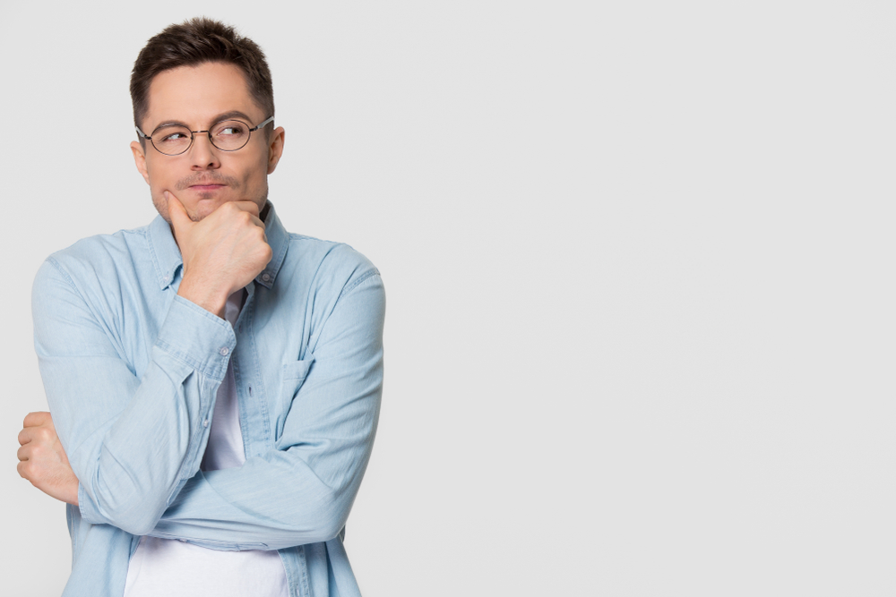 Thoughtful,Suspicious,Young,Man,Looking,Aside,At,Copy,Space,Feeling Rethinking how to offer value
