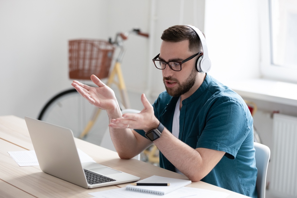 A remote employee wearing glasses on a video call