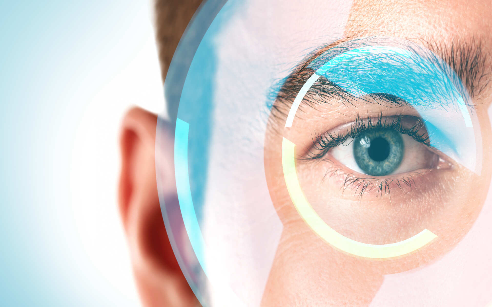 ok.vision vision benefits Close-up of an eye with a digital overlay representing vision benefits and eye health.