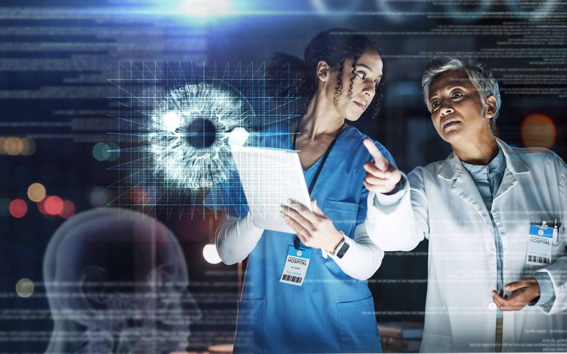 shutterstock_2254980603-2-1 Two optometrists analyzing data in an optometry practice.