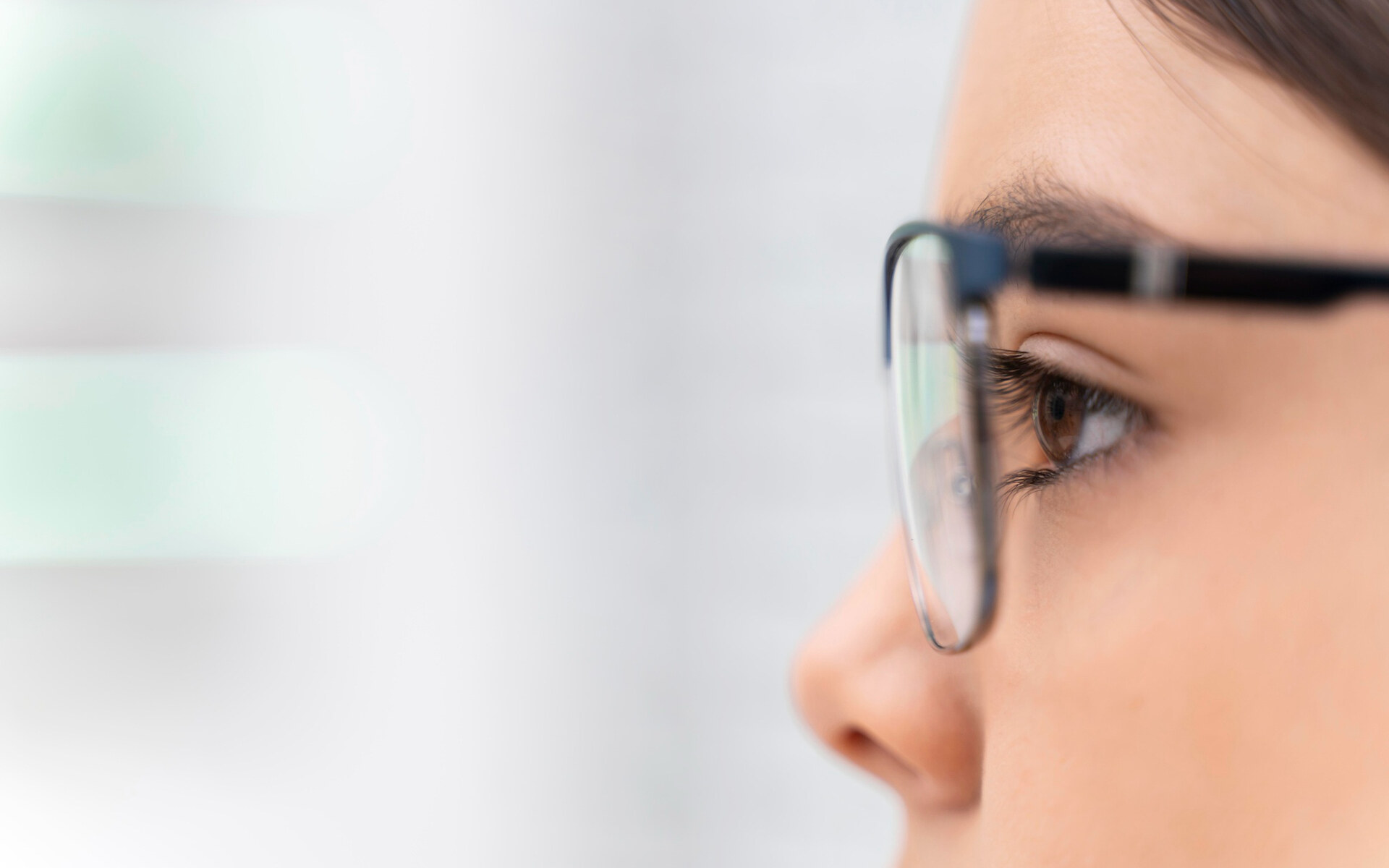 is vision insurance worth it Close-up of a person wearing glasses, prompting the question: is vision insurance worth it?